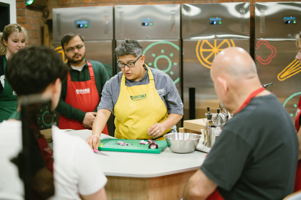 COOK! tutor Maz sharing tips and techniques on the Build a Banh Mi workshop