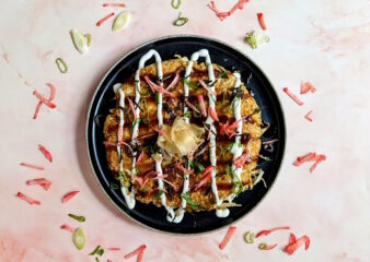 Traditional Okonomiyaki served with quick pickled radish, made on the Japanese Street Food class at COOK! in Manchester