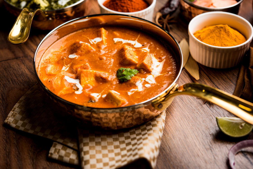 Silky cubes of paneer cheese, floating in a rich, buttery tomato, cashew gravy infused with sweet spicy flavours, smooth, aromatic, and utterly divine.
