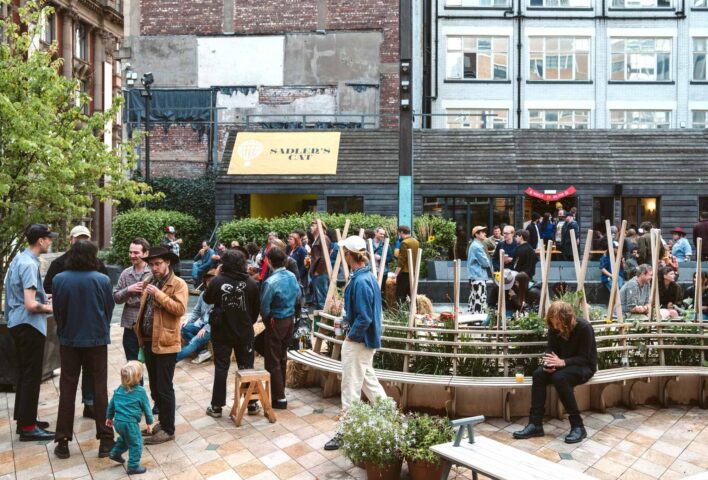 People gathering to enjoy an event at Saddler's Yard, NOMA.