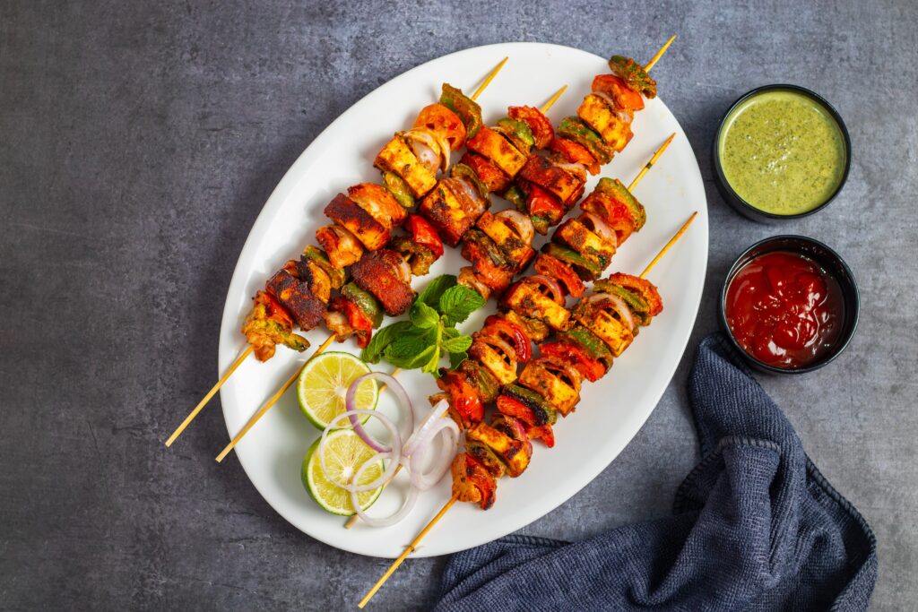 Tandoori Paneer Kebabs with Coriander Mint Drizzle and Smoked Paprika Brown Sugar Rubbed Veggies